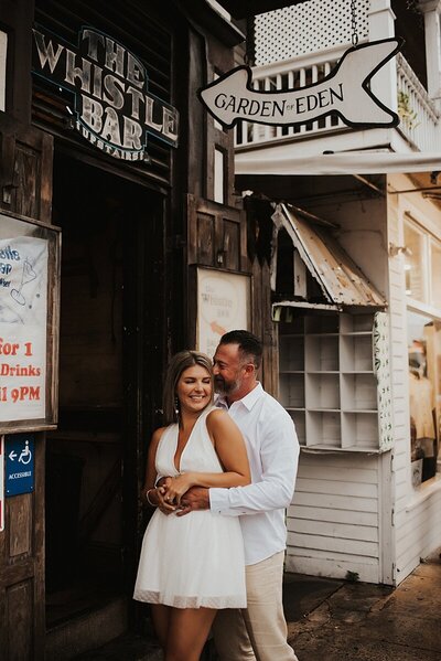 Key West Engagement Couple in front of The Whistle Bar