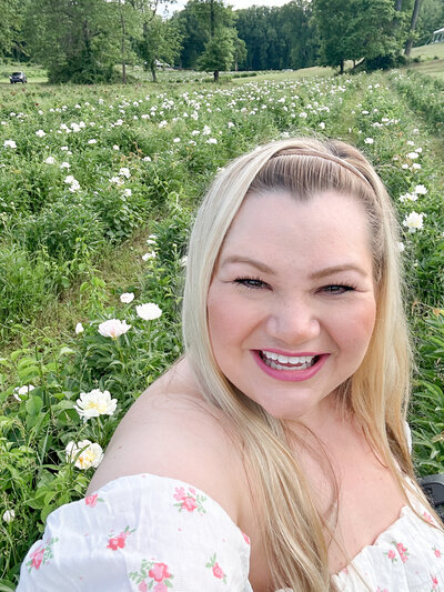 selfie portrait of a blond woman smiling