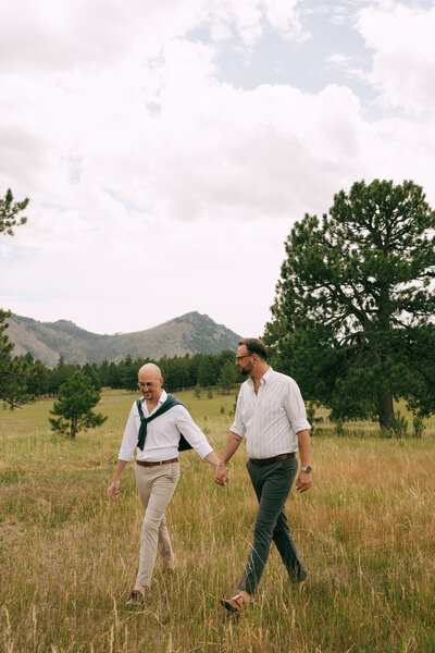 candid groom laughing with groomsmen before the wedding