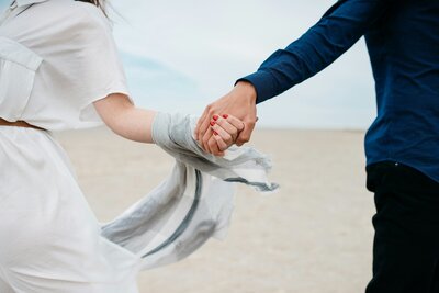 Man and woman holding hands