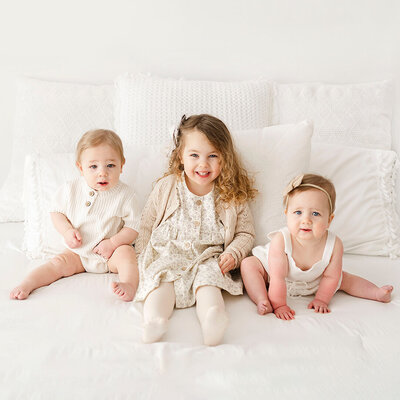 kids on bed by family photographer boston ma​
