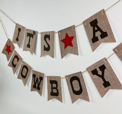 Burlap banner with black writing for cowboy baby shower