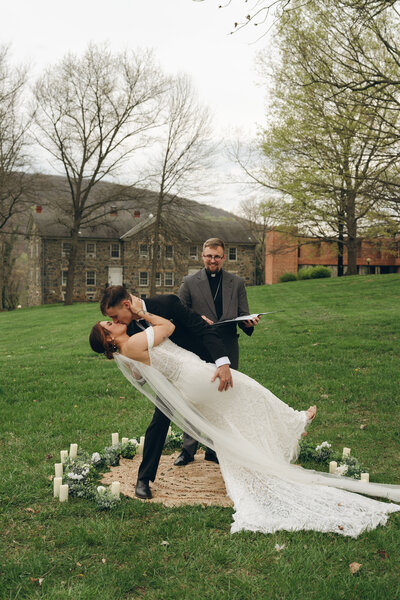 A young bridal couple swing dancing after their morning wedding outside of Austin, Texas. 