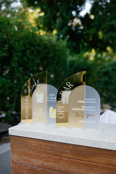 custom gold menu sign on bar at wedding