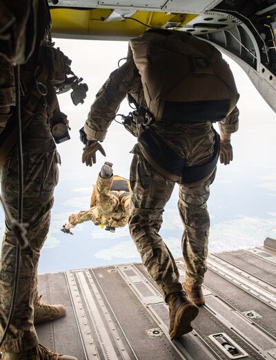 Dan Mckluskie preparing to parachute from aircraft during military jump exercise