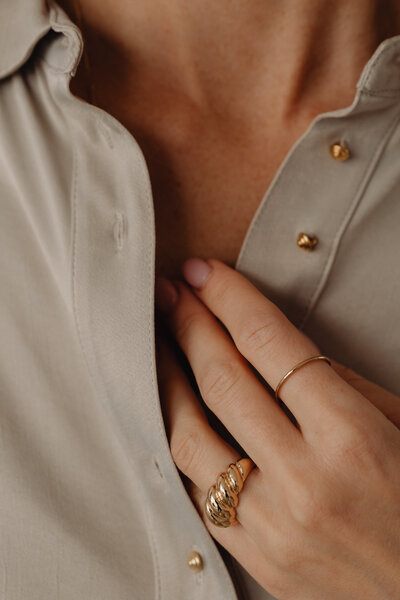 kaboompics_details-of-gold-jewelry-beautiful-woman-wearing-a-tan-silk-shirt-28099