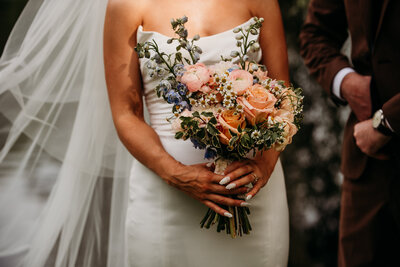Bride holding florals