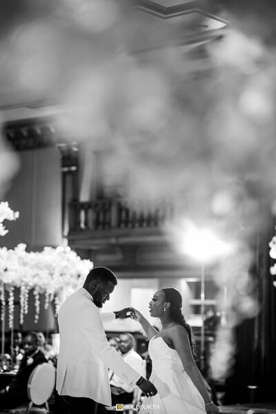 black and white image of bride and groom sharing first dance