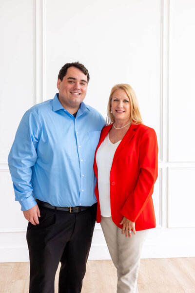 Stacy Meza and Chandler Ledesma of WLS Interests working together, representing the company’s collaborative culture and commitment to supporting property operations, marketing, and team development.