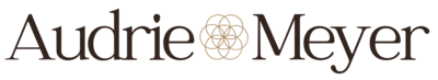 Image of Audrie Meyer's logo with her name and a flower of life icon in the center.