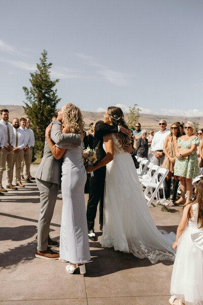 couple walking toward wedding reception on wedding night