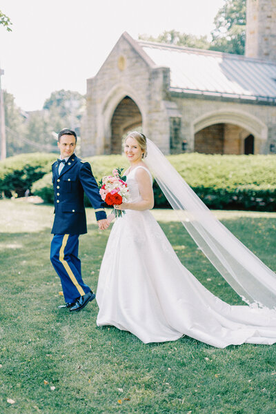 Bride and groom walk up memorial steps at their DC wedding