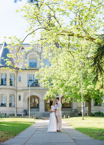 university wedding in Seattle in front of school building 
