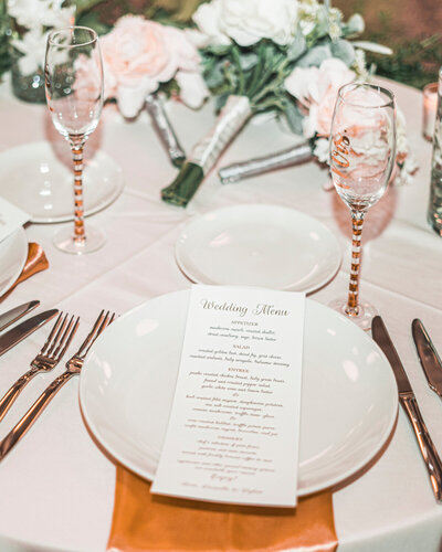 Wedding Menu with plates, utensils and wine glasses