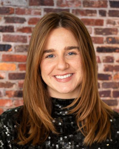 wedding planner in Tennessee standing in front of a brick wall