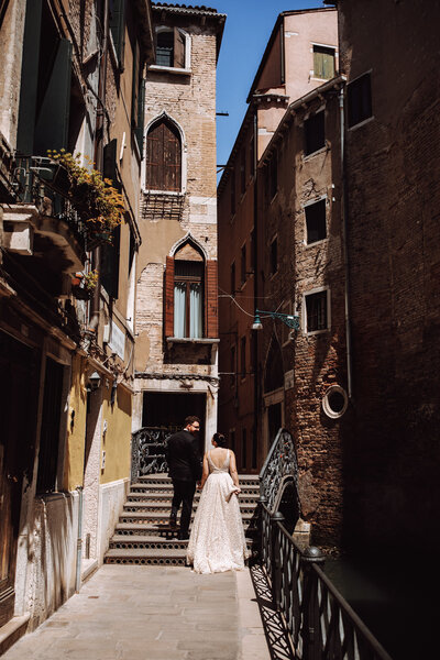 A couple walks through Italy during their bridal session.