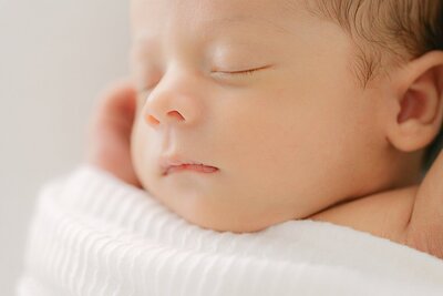 macro of sleeping baby's face during a newborn portrait session with Indianapolis photographer Brittney Lear