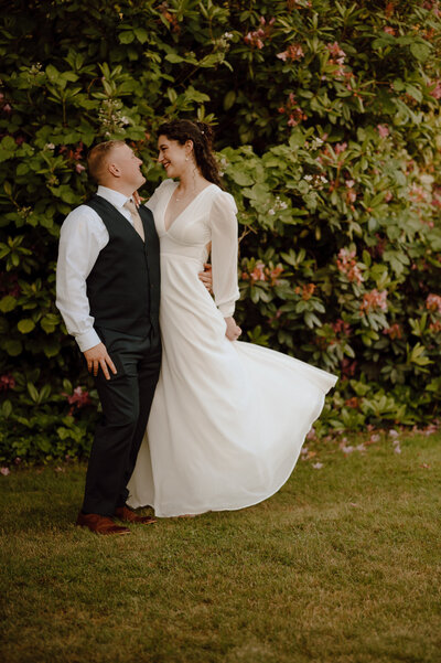 bride and groom walking away from camera