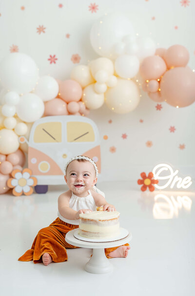 Baby celebrating her first birthday wearing a confetti dress