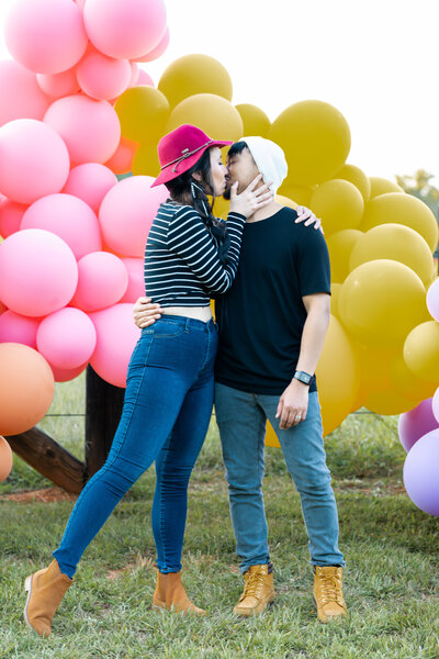 Engagement couple embracing on a porch swing