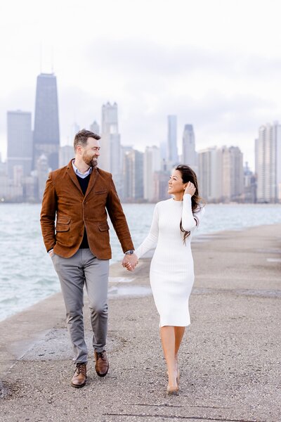 Couple walks along water at North Avenue Beach Chicago