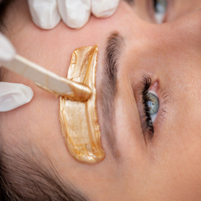 Woman getting brows waxed