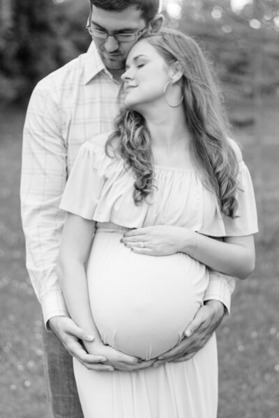 Close up of mom's hand on pregnant belly