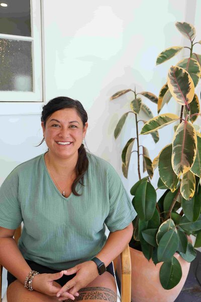 massage therapist with long curly hair