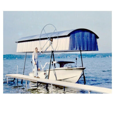 Vintage boat docked at boat lift