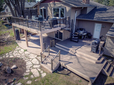 Aerial view of a multi-level deck with multiple platforms and staircases including a spiral staircase. 