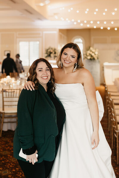 The Eventful Gals planner with bride at elegant reception setup, showcasing personalized wedding planning in Northeast Florida.