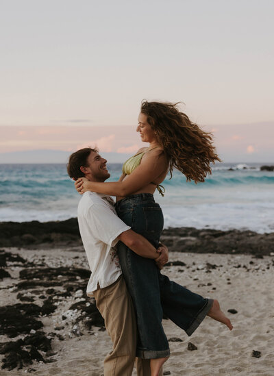 destination elopement photography  in Hawaii bride and groom laughing eloping on the beach