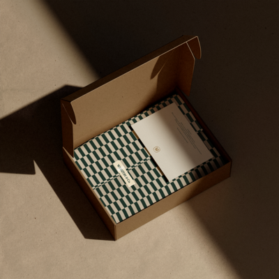 Heritage-inspired geometric packaging design in green and cream with thank you card for luxury dog treat brand