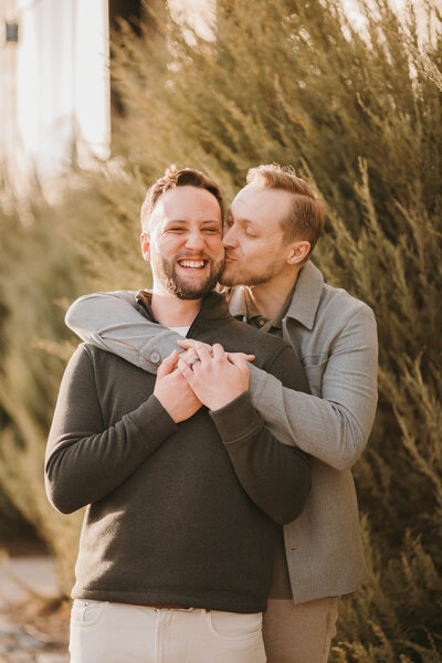 lgbtq couple holding each other in minneapolis