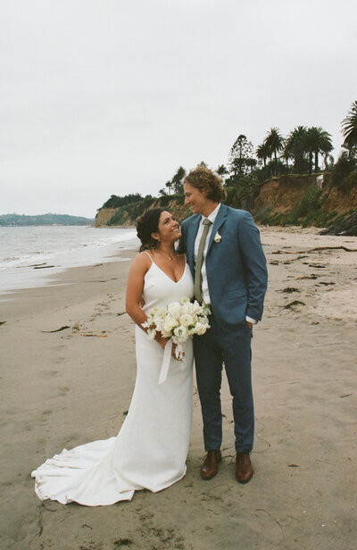 couple walking on beach in Santa Barbara