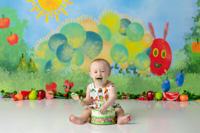 Hungry Little Caterpillar themed cake smash for a baby boy