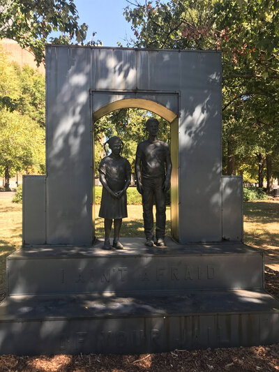 Statue of man and little girl