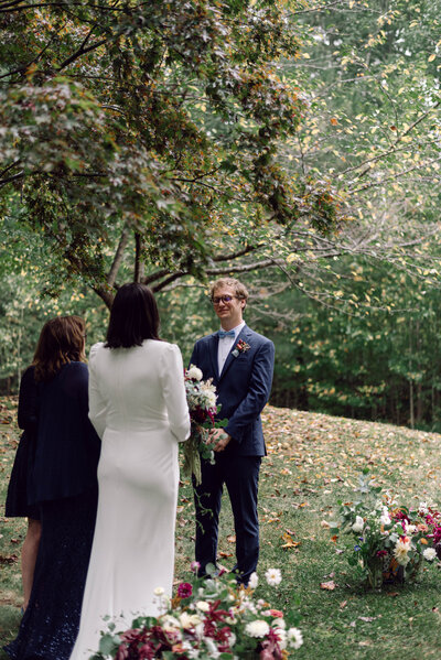 Bride and groom exchanging vows during a backyard wedding in Richmond, VA.