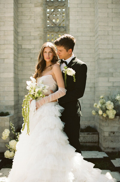 bride and groom at maitland art & history center on their wedding day taken by Lindsey Roman Photography
