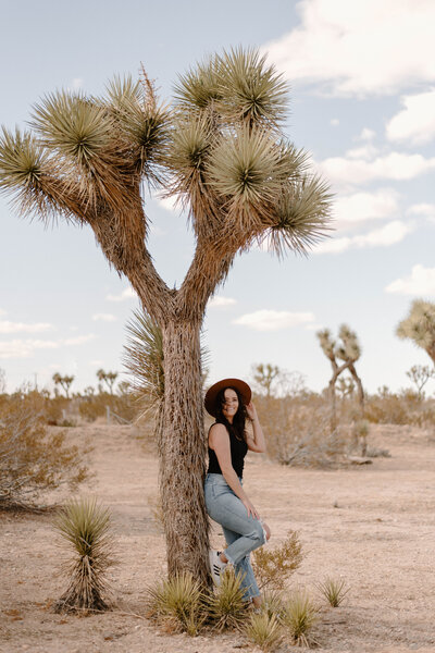 Girl standing by a joshua tree