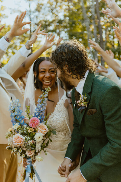 husband and wife smile at Juliette chapel