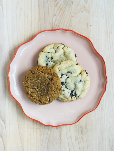 Three tempting homemade cookies arranged on a plate inviting subscribers to the hot plate list.