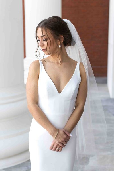 woman wearing v neck wedding dress