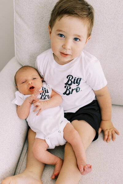 Big brother holding baby sibling