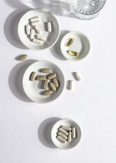 Bowls filled with vitamins and pills