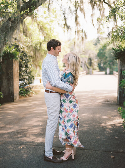 Airlie Gardens Wilmington NC engagement couple hugging