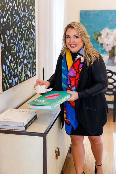 realtor woman staging props on a cupboard in a house before a visit by Atlanta brand photographer