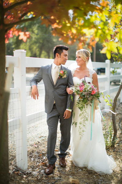 Bride and Groom standing under tree at their destination wedding in Sacramento Californai