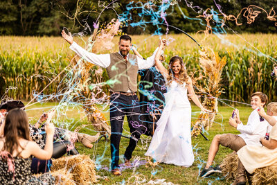 Just married couple celebrates with silly string shot, Baltimore wedding photography