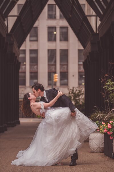 A couple kissing under an transparent umbrella.